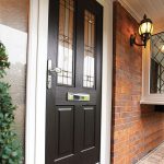 Black composite door with white frame