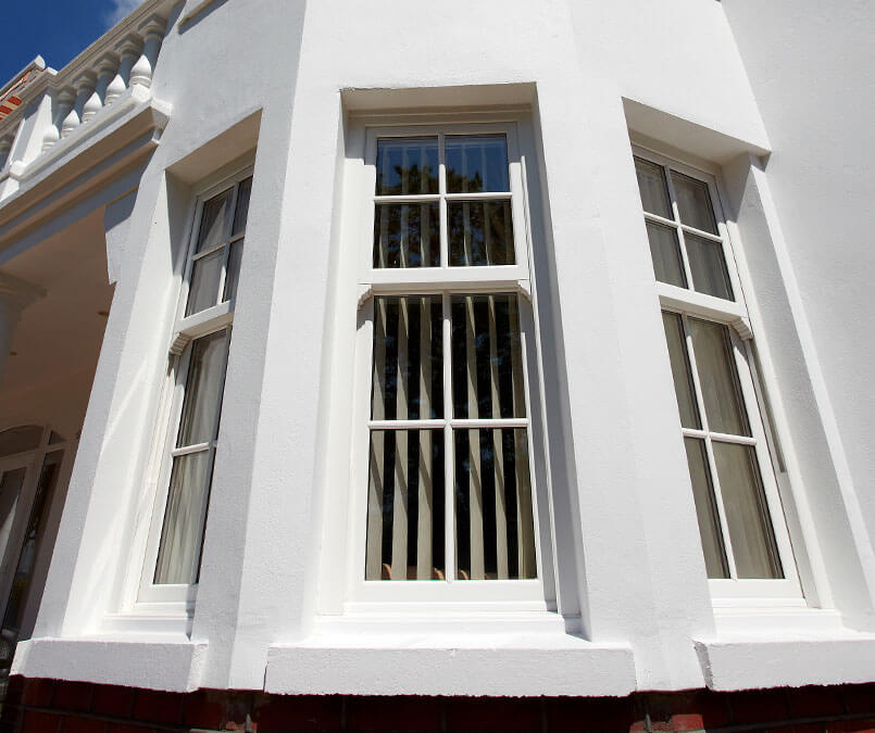 Triple vertical sliding windows